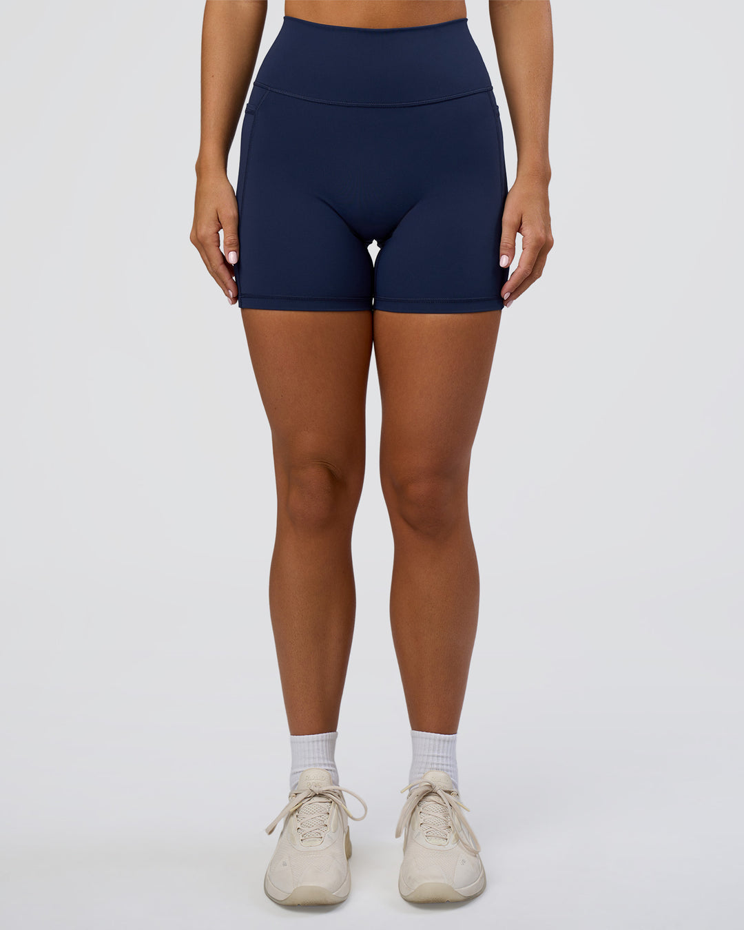 Woman wearing Fusion Ultra High-Rise 6" Short Pockets - Future Navy | Set:true | Angle:front | Model:Amity | Size:S - view 7
