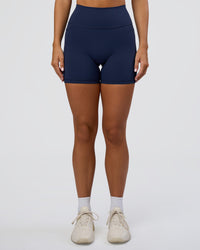 Woman wearing Fusion Ultra High-Rise 6" Short Pockets - Future Navy | Set:true | Angle:front | Model:Amity | Size:S | Thumbnail Index: 6