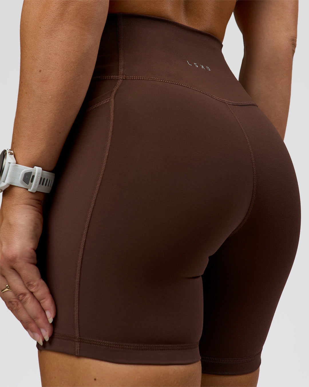 Woman wearing Fusion Ultra High-Rise 6" Short Pockets - Hot Chocolate | Model:Summer | Size:S - view 8