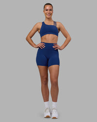 Woman wearing Fusion Ultra High-Rise 6" Short Pockets - Midnight Blue | Model:Charlize | Size:S | Thumbnail Index: 4
