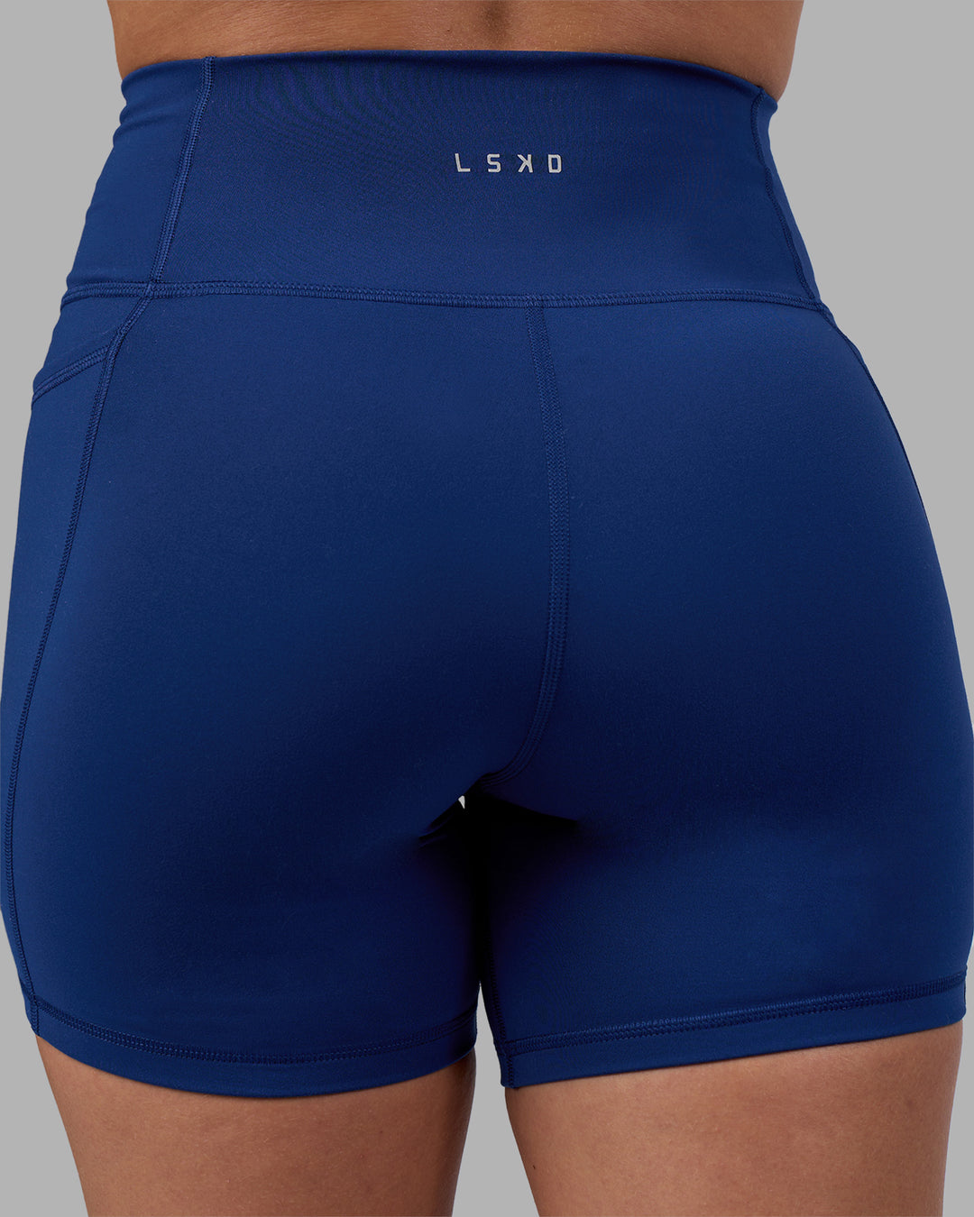 Woman wearing Fusion Ultra High-Rise 6" Short Pockets - Midnight Blue | Model:Charlize | Size:S - view 8