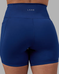 Woman wearing Fusion Ultra High-Rise 6" Short Pockets - Midnight Blue | Model:Charlize | Size:S | Thumbnail Index: 7
