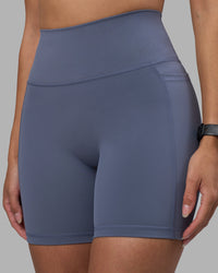Woman wearing Fusion Ultra High-Rise 6" Short Pockets - Night Shadow | Model:Rhiley | Size:S | Thumbnail Index: 5