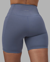 Woman wearing Fusion Ultra High-Rise 6" Short Pockets - Night Shadow | Model:Rhiley | Size:S | Thumbnail Index: 7