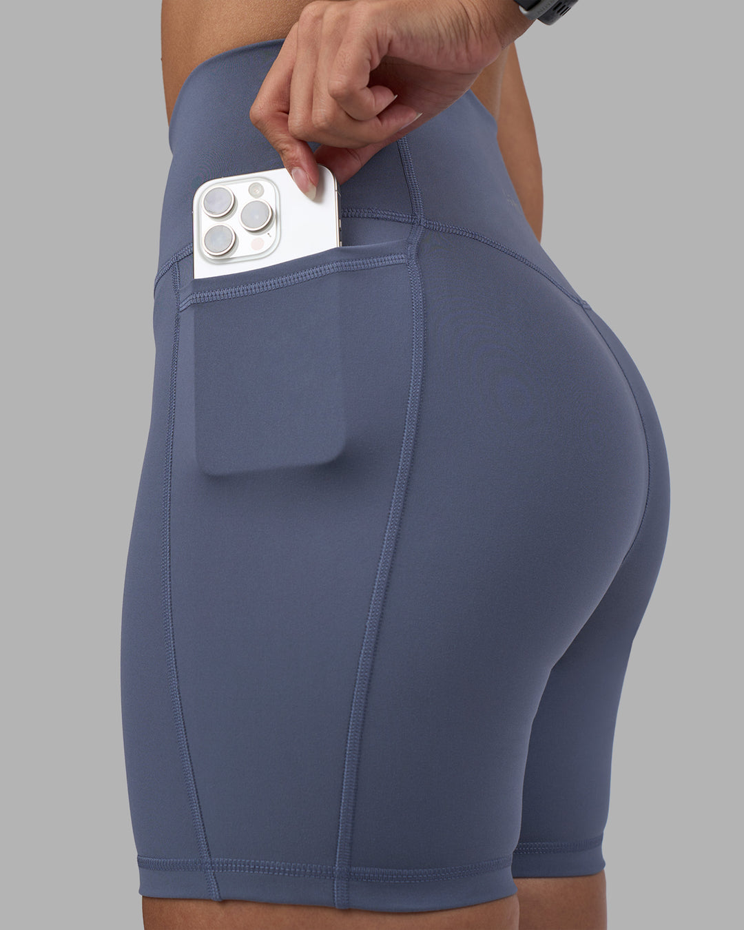 Woman wearing Fusion Ultra High-Rise 6" Short Pockets - Night Shadow | Set:true | Angle:closeup | Model:Rhiley | Size:S - view 3