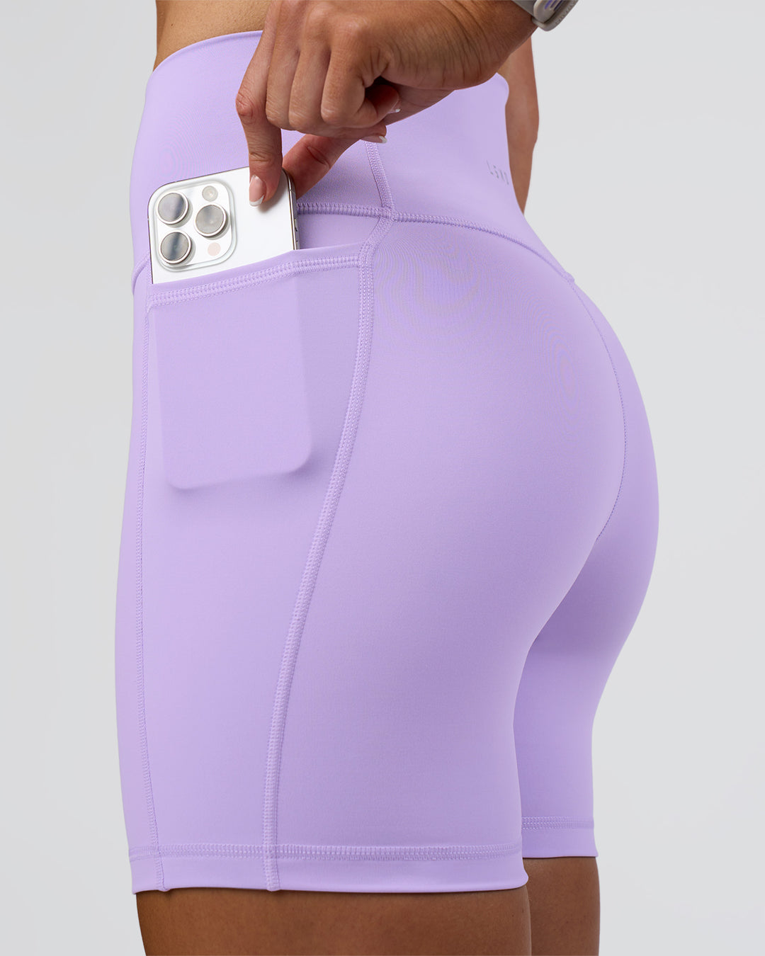 Woman wearing Fusion Ultra High-Rise 6" Short Pockets - Pale Lilac | Set:true | Angle:closeup | Model:Emelia | Size:S - view 2