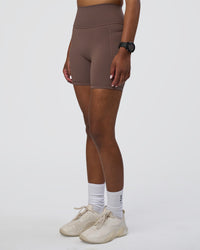 Woman wearing Fusion Ultra High-Rise 6" Short Pockets - Peppercorn | Set:true | Angle:side | Model:Rica | Size:S | Thumbnail Index: 5