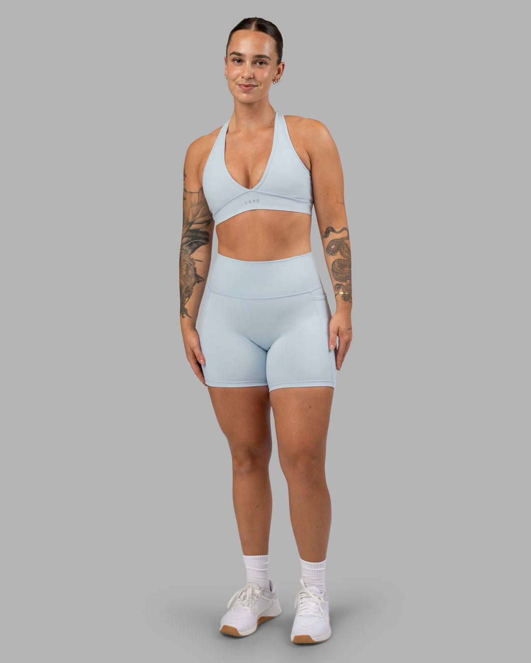 Woman wearing Fusion Ultra High-Rise 6" Short Pockets - Skyride| Model:Robyn | Size:S - view 3
