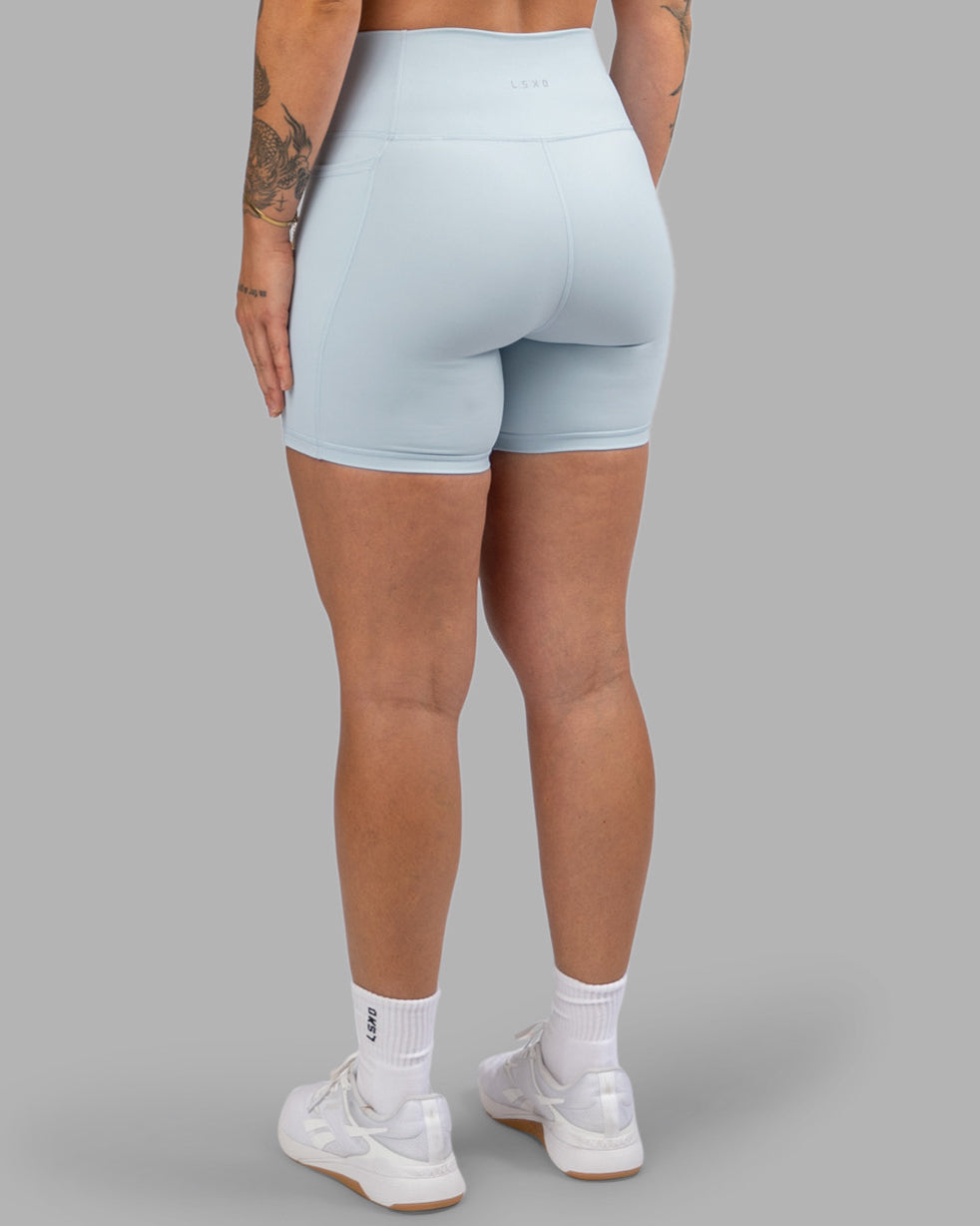 Woman wearing Fusion Ultra High-Rise 6" Short Pockets - Skyride| Model:Robyn | Size:S - view 4