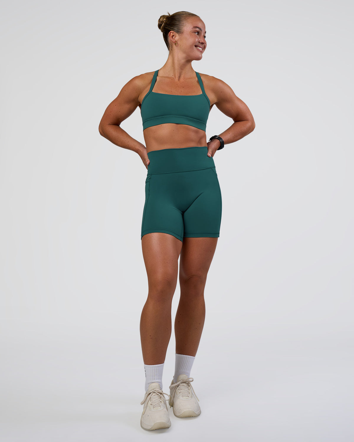 Woman wearing Fusion Ultra High-Rise 6" Short Pockets - Transformative Teal | Model:Sav | Size:S