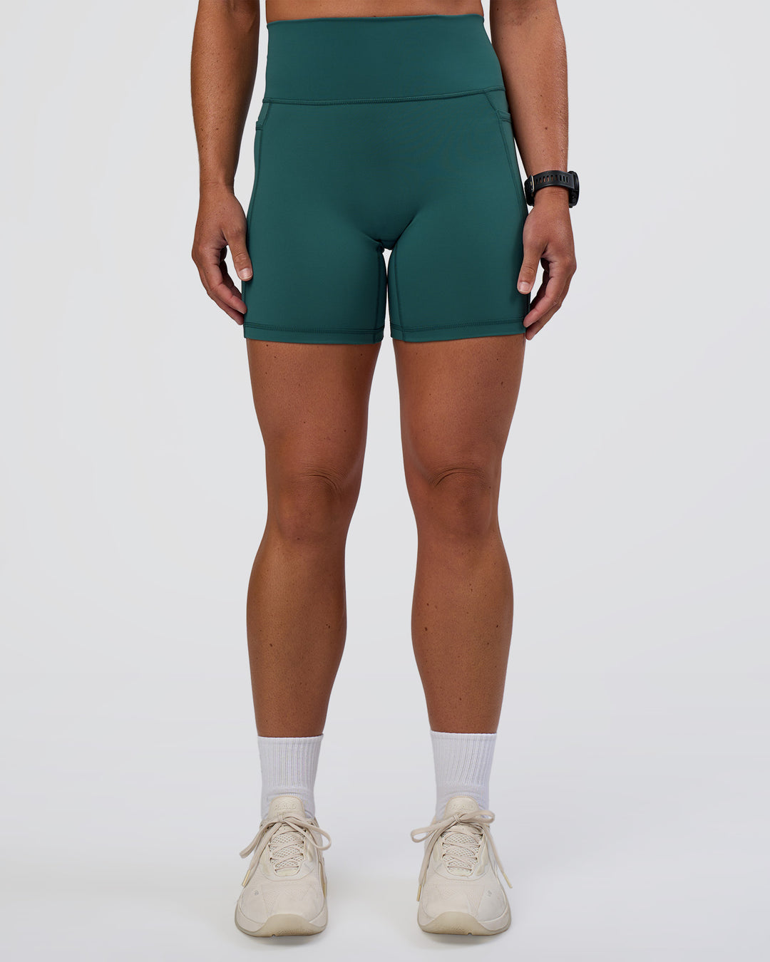 Woman wearing Fusion Ultra High-Rise 6" Short Pockets - Transformative Teal | Set:true | Angle:front | Model:Sav | Size:S - view 3
