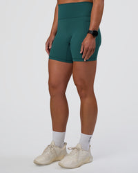 Woman wearing Fusion Ultra High-Rise 6" Short Pockets - Transformative Teal | Set:true | Angle:side | Model:Sav | Size:S | Thumbnail Index: 6