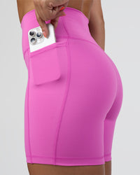 Woman wearing Fusion Ultra High-Rise 6" Short Pockets - Ultra Fuchsia | Set:true | Angle:closeup | Model:Abbey | Size:S | Thumbnail Index: 5