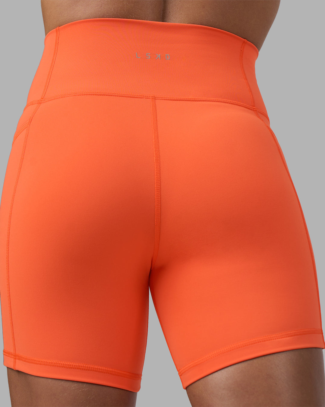 Woman wearing Fusion Ultra High-Rise 6" Short Pockets - Ultra Orange | Model:Katie | Size:S - view 8