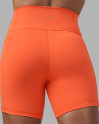 Woman wearing Fusion Ultra High-Rise 6" Short Pockets - Ultra Orange | Model:Katie | Size:S | Thumbnail Index: 7
