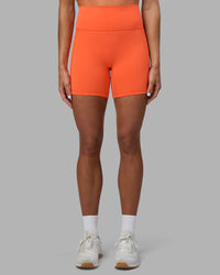 Woman wearing Fusion Ultra High-Rise 6" Short Pockets - Ultra Orange | Set:true | Angle:front | Model:Katie | Size:S | Thumbnail Index: 0