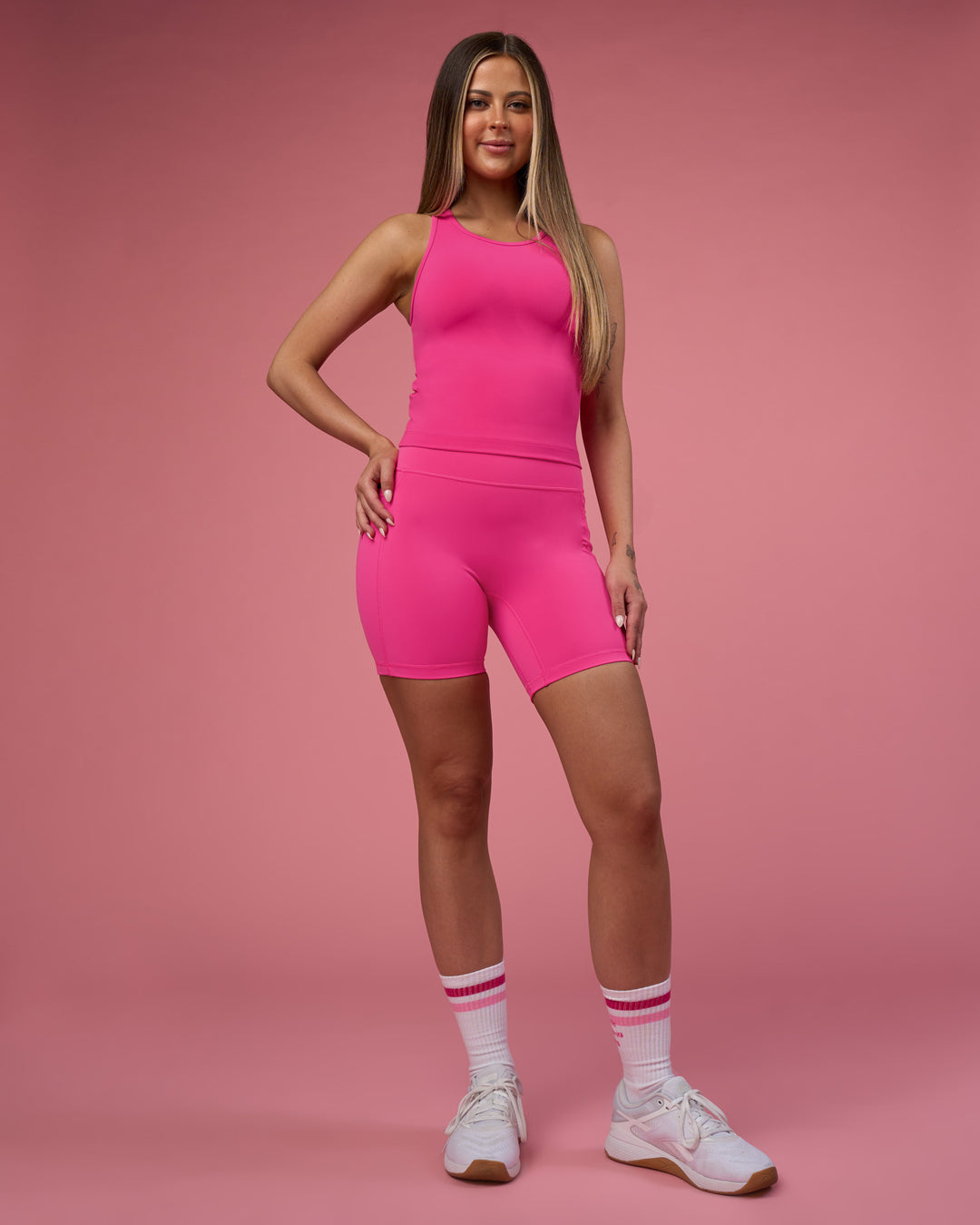 Woman wearing Fusion Ultra High-Rise 6" Short Pockets - Ultra Pink | Model:Tianah | Size:S - view 11