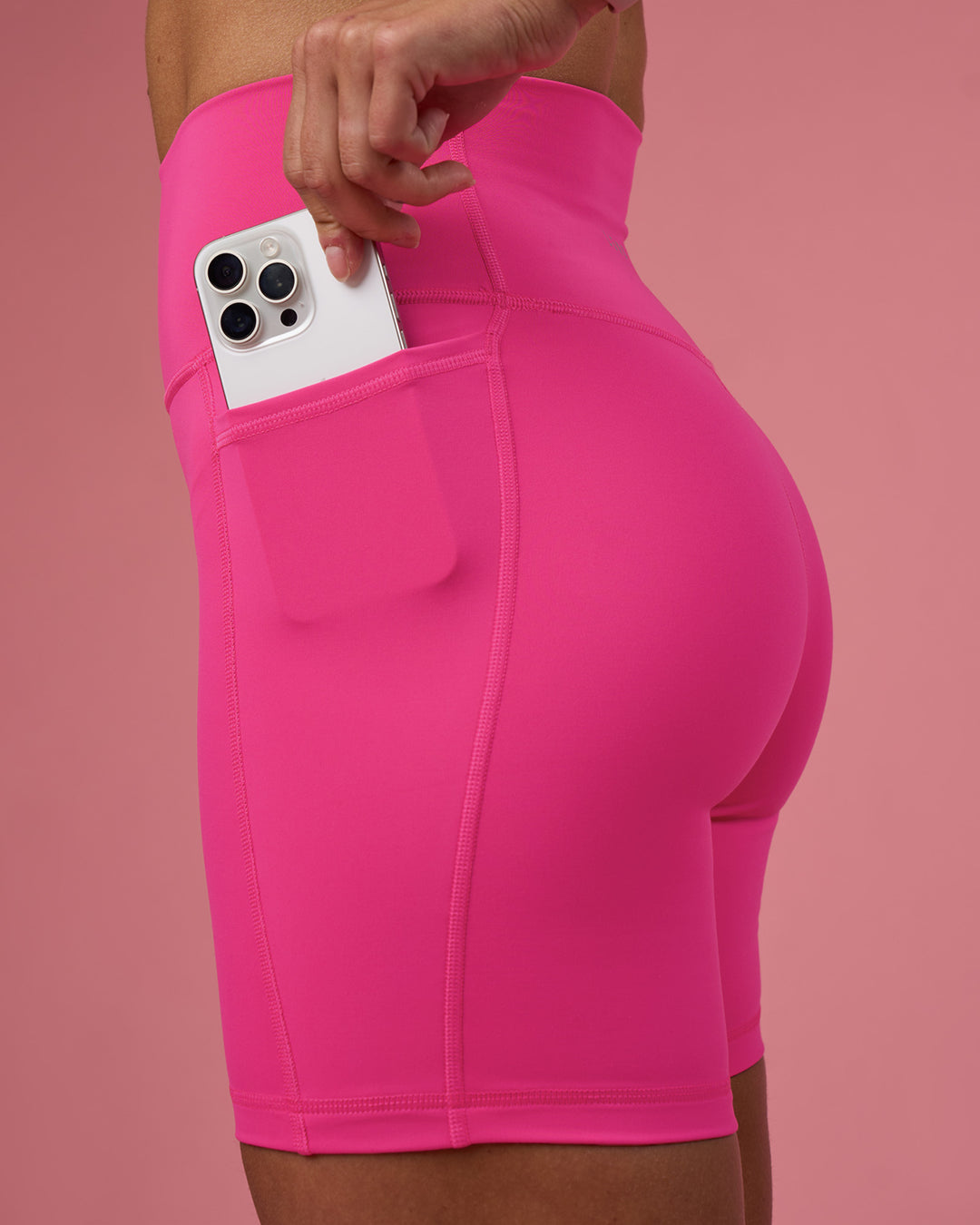 Woman wearing Fusion Ultra High-Rise 6" Short Pockets - Ultra Pink | Set:true | Angle:closeup | Model:Hannah | Size:S - view 3