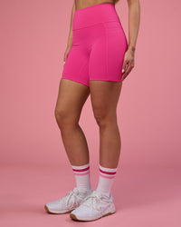 Woman wearing Fusion Ultra High-Rise 6" Short Pockets - Ultra Pink | Set:true | Angle:side | Model:Tianah | Size:S | Thumbnail Index: 11