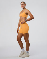 Woman wearing Fusion Ultra High-Rise 6" Short Pockets - Warm Apricot | Model:Emelia | Size:S | Thumbnail Index: 4
