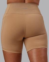 Woman wearing Fusion Ultra High-Rise 6" Short Pockets - Warm Smoke | Model:Phoebe | Size:S | Thumbnail Index: 5
