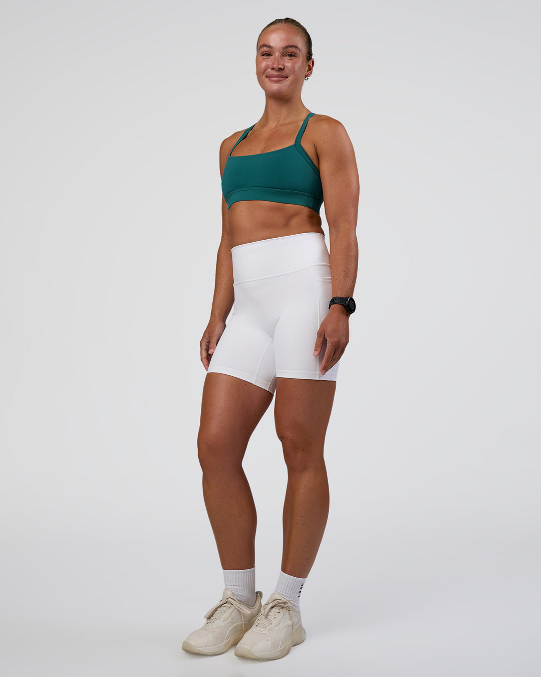 Woman wearing Fusion Ultra High-Rise 6" Short Pockets - White | Model:Sav | Size:S - view 5