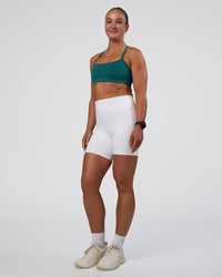 Woman wearing Fusion Ultra High-Rise 6" Short Pockets - White | Model:Sav | Size:S | Thumbnail Index: 4