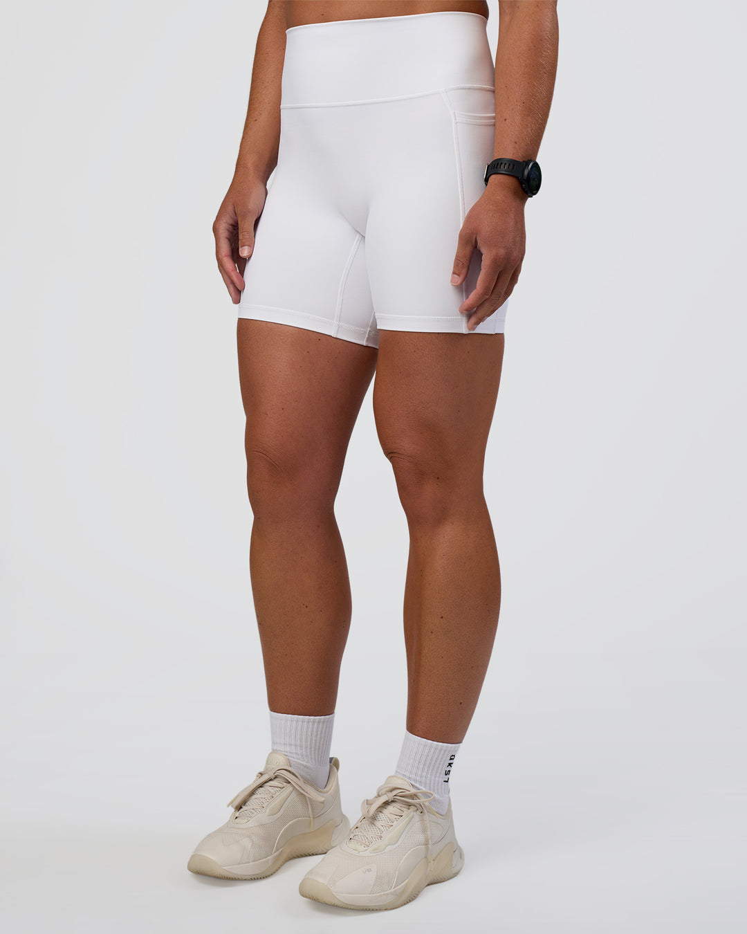 Woman wearing Fusion Ultra High-Rise 6" Short Pockets - White | Set:true | Angle:side | Model:Sav | Size:S - view 3