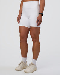 Woman wearing Fusion Ultra High-Rise 6" Short Pockets - White | Set:true | Angle:side | Model:Sav | Size:S | Thumbnail Index: 2