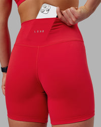 Woman wearing Fusion Ultra High-Rise 6" Short - Scarlet | Set:true | Angle:closeup | Model:Keisha | Size:S | Thumbnail Index: 5