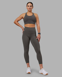 Woman wearing Fusion Ultra High-Rise 7/8 Legging Pockets - Dark Storm | Model:Keisha | Size:S | Thumbnail Index: 0