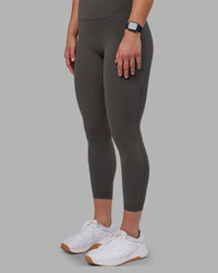 Woman wearing Fusion Ultra High-Rise 7/8 Legging Pockets - Dark Storm | Model:Keisha | Size:S | Thumbnail Index: 1
