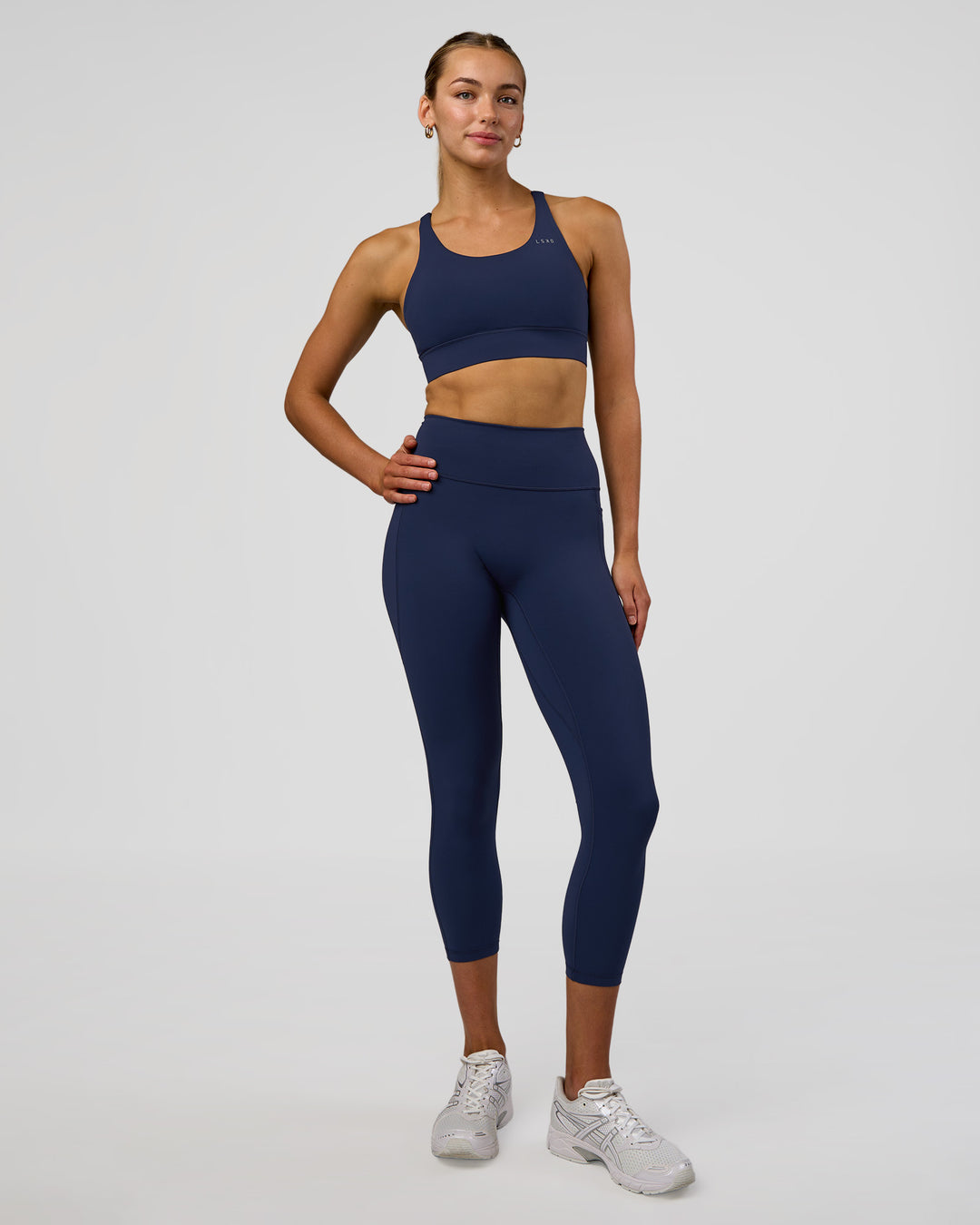 Woman wearing Fusion Ultra High-Rise 7/8 Legging Pockets - Future Navy | Model:Evie | Size:S - view 5