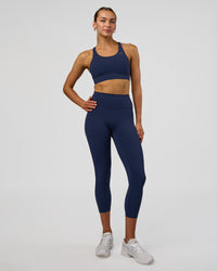 Woman wearing Fusion Ultra High-Rise 7/8 Legging Pockets - Future Navy | Model:Evie | Size:S | Thumbnail Index: 4