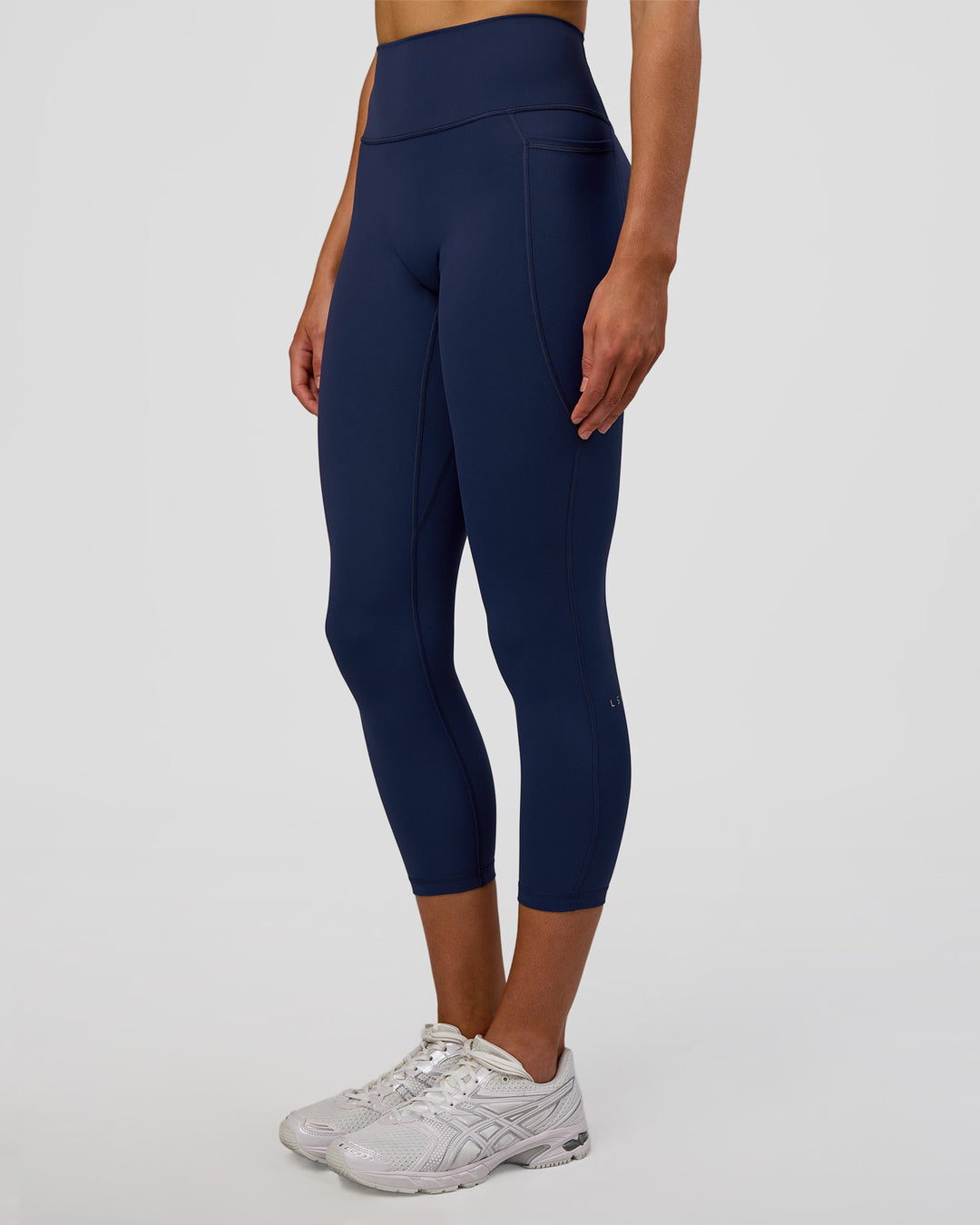 Woman wearing Fusion Ultra High-Rise 7/8 Legging Pockets - Future Navy | Model:Evie | Size:S - view 3