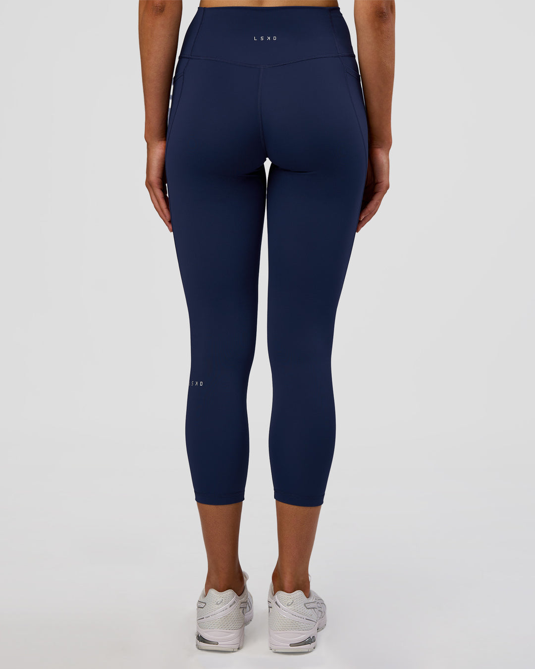 Woman wearing Fusion Ultra High-Rise 7/8 Legging Pockets - Future Navy | Model:Evie | Size:S - view 4