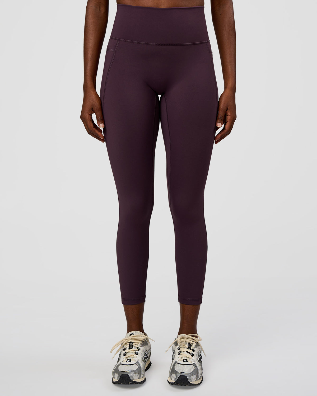 Woman wearing Fusion Ultra High-Rise 7/8 Legging Pockets - Midnight Plum | Model:Ellie | Size:S