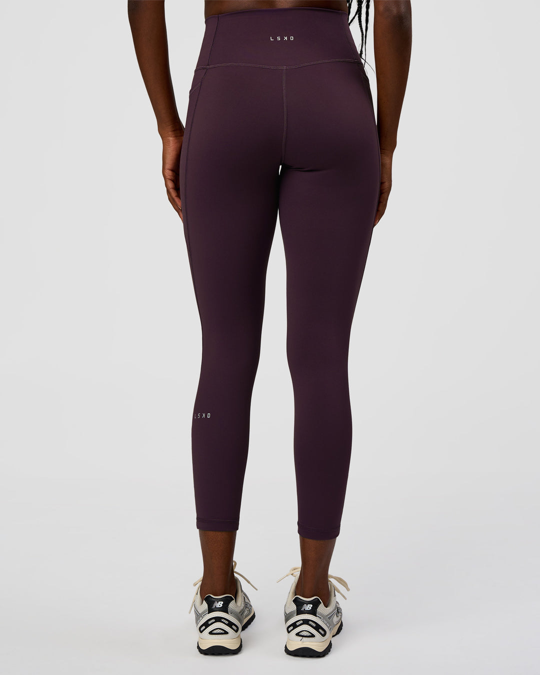 Woman wearing Fusion Ultra High-Rise 7/8 Legging Pockets - Midnight Plum | Model:Ellie | Size:S - view 4