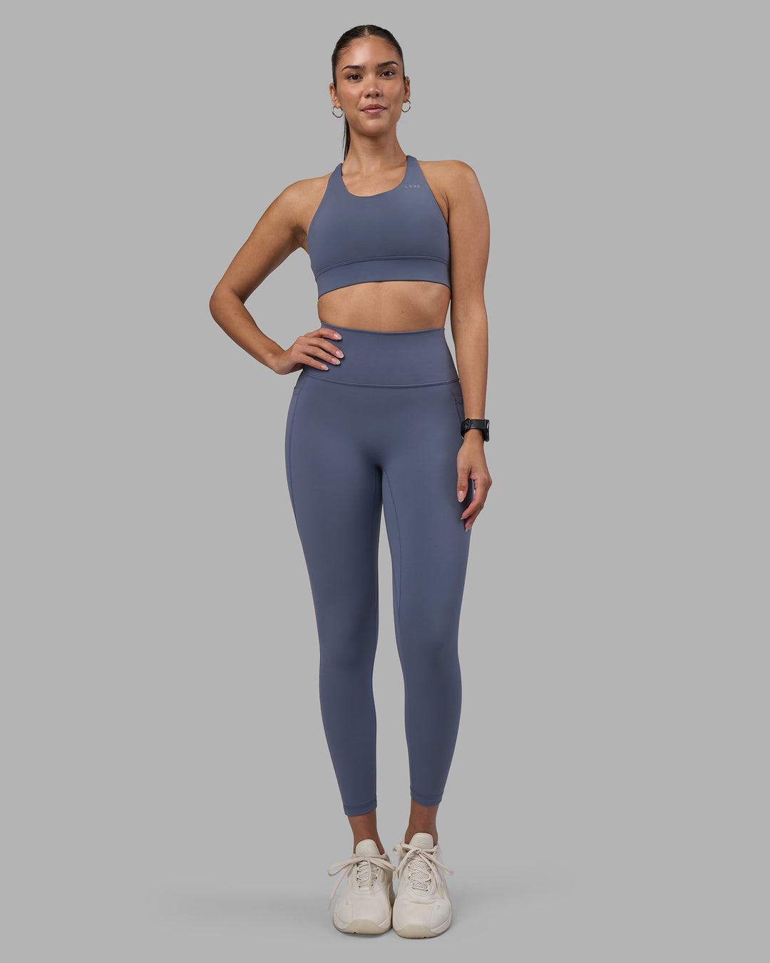 Woman wearing Fusion Ultra High-Rise 7/8 Legging Pockets - Night Shadow | Model:Rhiley | Size:S - view 5