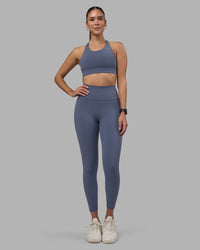 Woman wearing Fusion Ultra High-Rise 7/8 Legging Pockets - Night Shadow | Model:Rhiley | Size:S | Thumbnail Index: 4