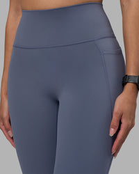 Woman wearing Fusion Ultra High-Rise 7/8 Legging Pockets - Night Shadow | Model:Rhiley | Size:S | Thumbnail Index: 2