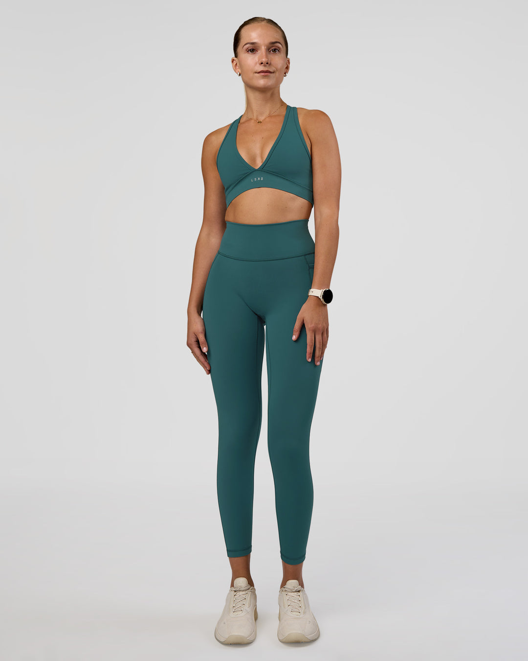 Woman wearing Fusion Ultra High-Rise 7/8 Legging Pockets - Transformative Teal | Model:Myrte | Size:S - view 2