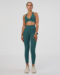 Woman wearing Fusion Ultra High-Rise 7/8 Legging Pockets - Transformative Teal | Model:Myrte | Size:S | Thumbnail Index: 1