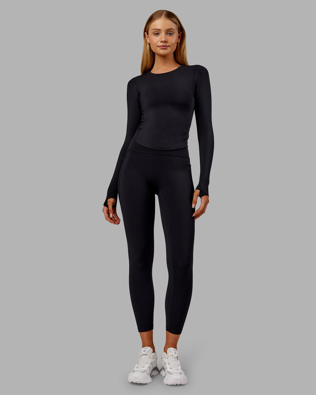 Woman wearing Fusion Ultra High-Rise 7/8 Thermal Legging Pockets - Black | Model:Ella | Size:S - view 1
