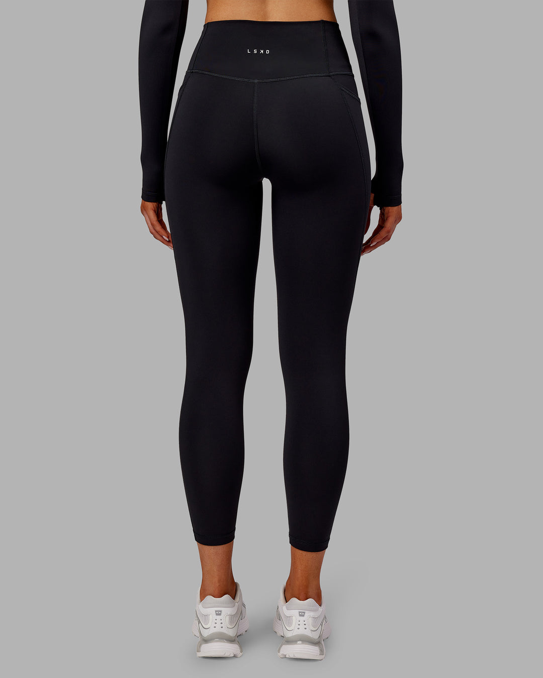Woman wearing Fusion Ultra High-Rise 7/8 Thermal Legging Pockets - Black | Model:Ella | Size:S - view 4