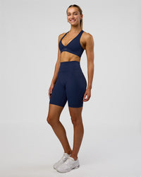 Woman wearing Fusion Ultra High-Rise 9" Short Pockets - Future Navy | Model:Evie | Size:S | Thumbnail Index: 3