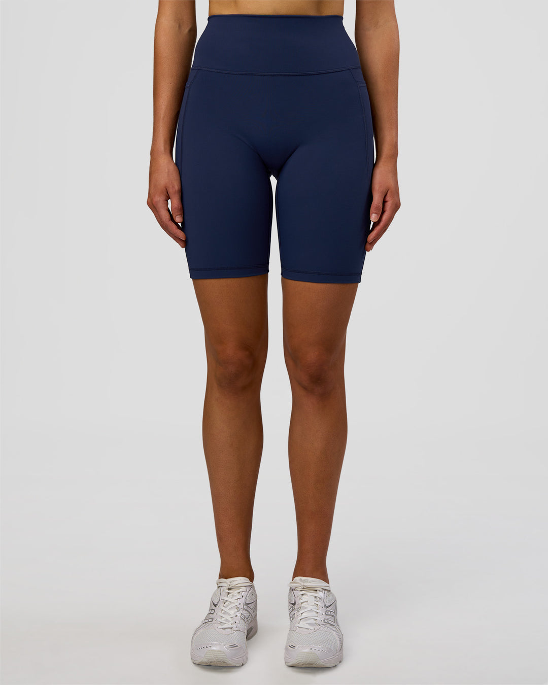 Woman wearing Fusion Ultra High-Rise 9" Short Pockets - Future Navy | Model:Evie | Size:S - view 2
