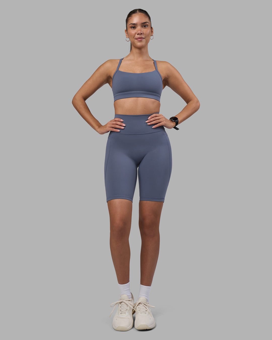 Woman wearing Fusion Ultra High-Rise 9" Short Pockets - Night Shadow | Model:Rhiley | Size:S - view 2