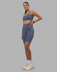 Woman wearing Fusion Ultra High-Rise 9" Short Pockets - Night Shadow | Model:Rhiley | Size:S | Thumbnail Index: 4
