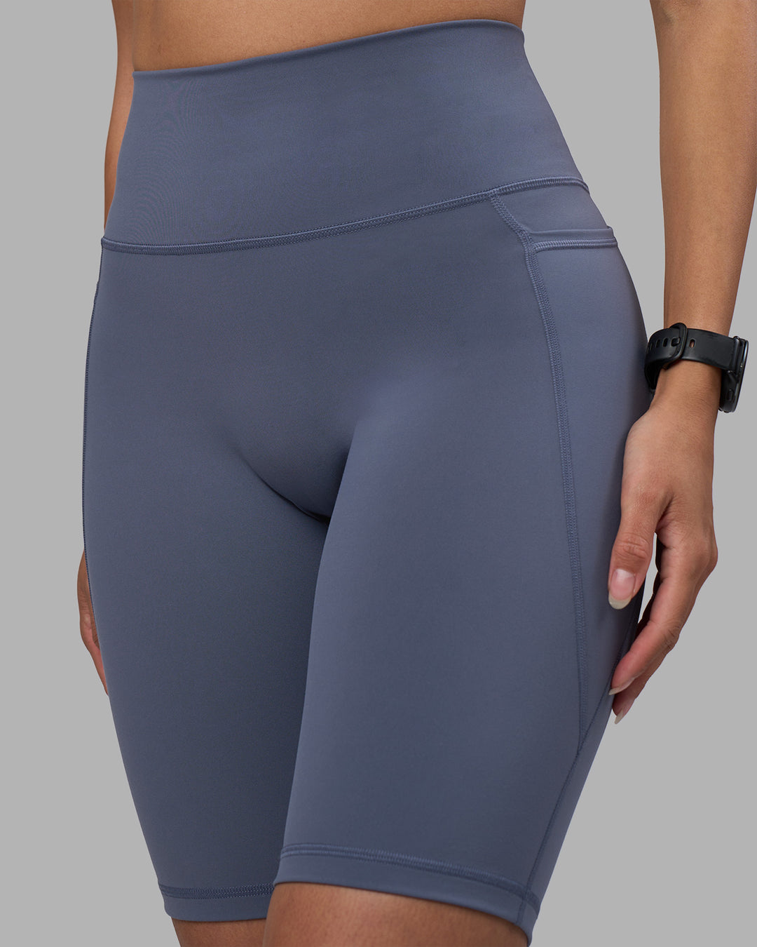 Woman wearing Fusion Ultra High-Rise 9" Short Pockets - Night Shadow | Model:Rhiley | Size:S - view 6